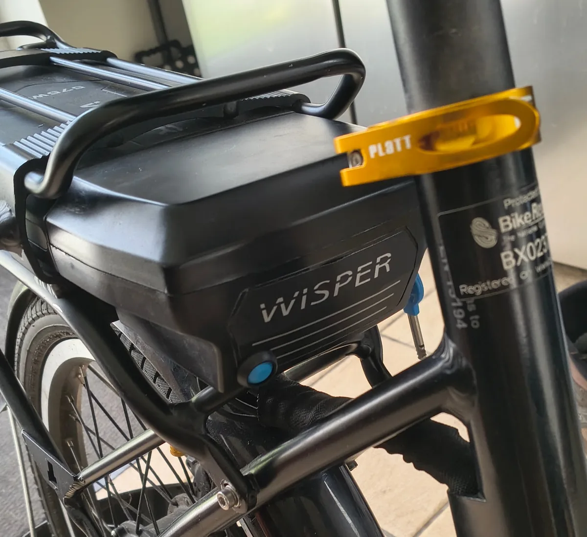 The IP-rated bypass switch, a small blue toggle, fitted next to the Wisper battery pack